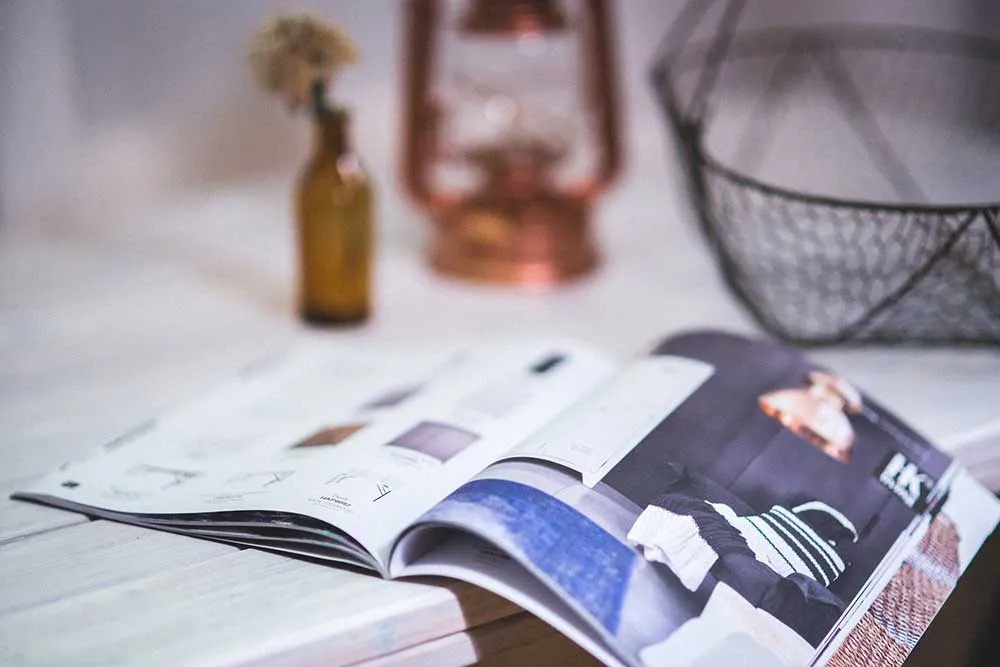 Magazine open on a table in Bestype Printing NYC's local print shop