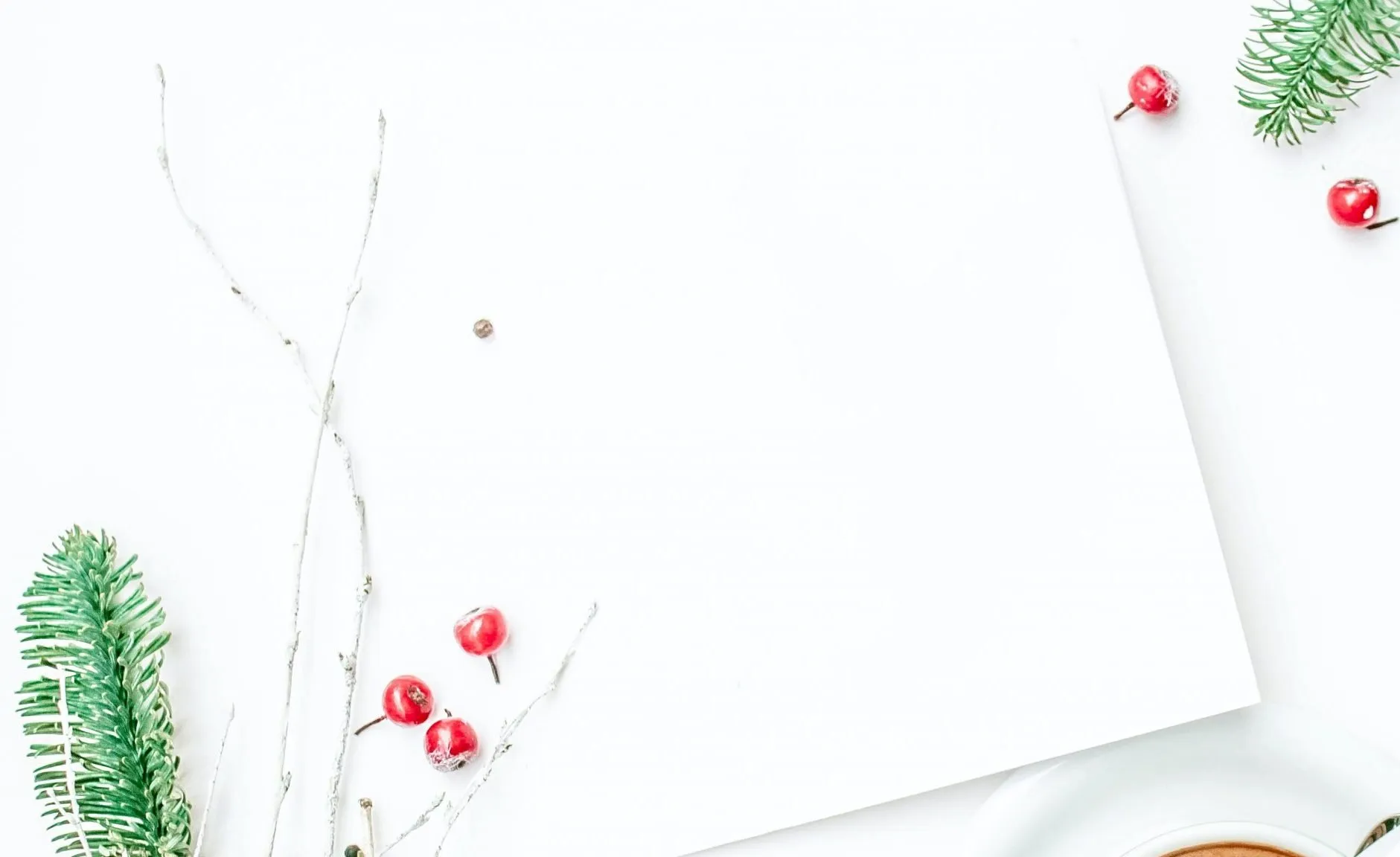 a white wall with red berries