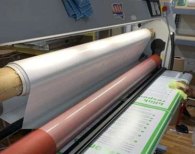 Large format printer laminating posters