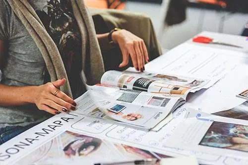 Woman flipping through a magazine